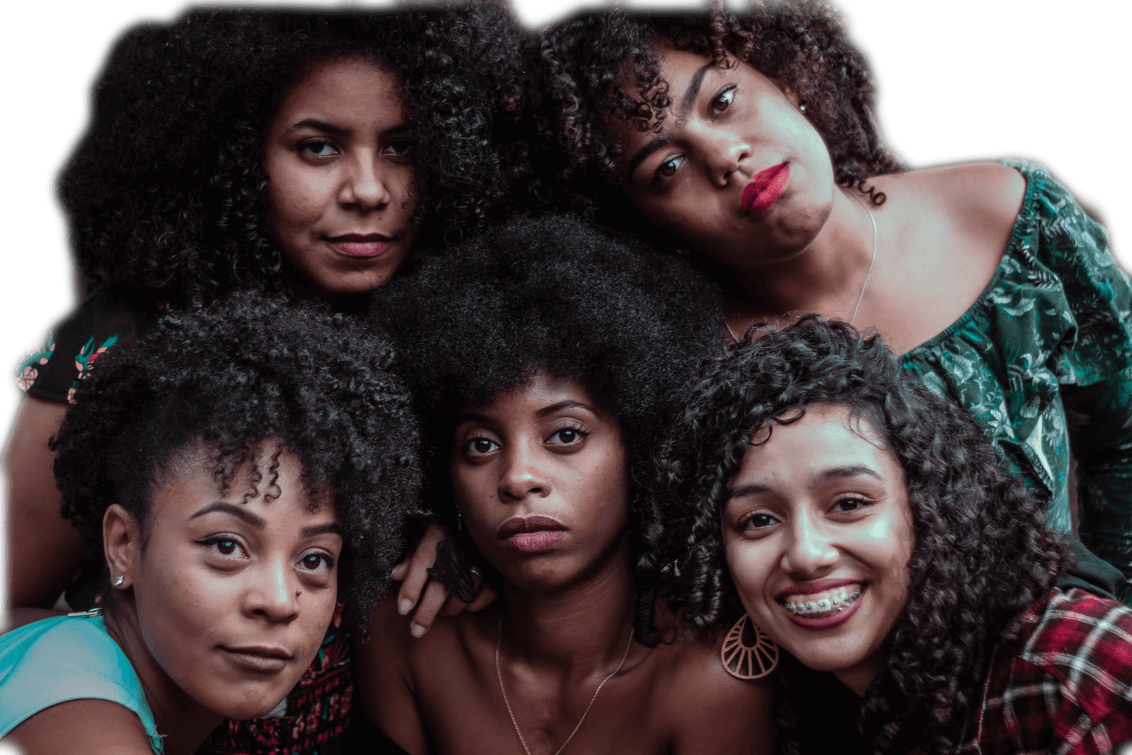 A diverse group of women proudly showcasing their natural hair textures, celebrating their beauty and individuality.
